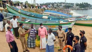 Police personnel and coast guard wardens talk to fishermen living near Vizhinjam seashore in view of Cyclone Burevi in Thiruvananthapuram in this file photo.(PTI Photo) Police personnel and coast guard wardens talk to fishermen living near Vizhinjam seashore in view of Cyclone Burevi in Thiruvananthapuram in this file photo.(PTI Photo)