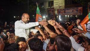 Telangana state BJP President Bandi Sanjay Kumar along with other party workers celebrate the Greater Hyderabad Municipal Corporation (GHMC) election results in Hyderabad on Friday.(PTI) Telangana state BJP President Bandi Sanjay Kumar along with other party workers celebrate the Greater Hyderabad Municipal Corporation (GHMC) election results in Hyderabad on Friday.(PTI)