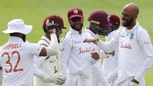West Indies' Roston Chase celebrates taking the wicket of England's Rory Burns, caught by West Indies' Rakheem Cornwall with teammates, as play resumes behind closed doors following the outbreak of the coronavirus disease (COVID-19).(REUTERS)