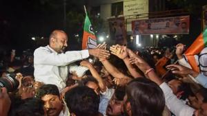 Telangana state BJP President Bandi Sanjay Kumar along with other party workers celebrate the Greater Hyderabad Municipal Corporation (GHMC) election results in Hyderabad on Friday.(PTI photo) Telangana state BJP President Bandi Sanjay Kumar along with other party workers celebrate the Greater Hyderabad Municipal Corporation (GHMC) election results in Hyderabad on Friday.(PTI photo)