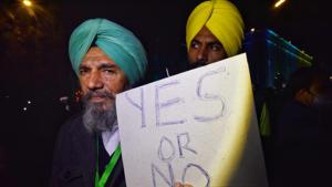 A farmer leader showing the ‘yes or no’ placard which they brought along with them for Saturday’s meeting where they sought Centre’s answer in ‘yes’ or ‘no’ on whether the laws will be withdrawn. (Photo: HT) A farmer leader showing the ‘yes or no’ placard which they brought along with them for Saturday’s meeting where they sought Centre’s answer in ‘yes’ or ‘no’ on whether the laws will be withdrawn. (Photo: HT)