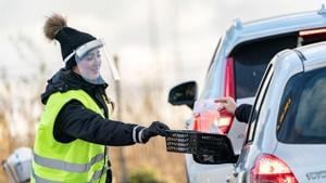 A person waring a protective mask collects coronavirus self tests from people in cars at a testing site in the car park of Svagertorp railway station, amid the coronavirus disease (Covid-19) outbreak, in Malmo, Sweden.(Reuters) A person waring a protective mask collects coronavirus self tests from people in cars at a testing site in the car park of Svagertorp railway station, amid the coronavirus disease (Covid-19) outbreak, in Malmo, Sweden.(Reuters)