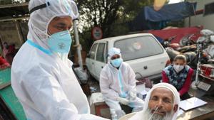 File photo: A health worker collects a nasal sample from a man for Covid-19 test.(PTI) File photo: A health worker collects a nasal sample from a man for Covid-19 test.(PTI)