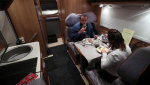 Customers enjoy dinner sitting inside a motorhome camper parked at the Belgian restaurant Matthias And Sea, despite the COVID-19 pandemic lockdown in Tarcienne, Belgium.(REUTERS) Customers enjoy dinner sitting inside a motorhome camper parked at the Belgian restaurant Matthias And Sea, despite the COVID-19 pandemic lockdown in Tarcienne, Belgium.(REUTERS)