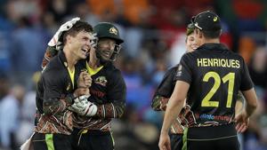 Australia's Mitchell Swepson, left, is congratulated by teammates after taking the wicket of India's Virat Kohli for 9 runs during their T20 international cricket match at Manuka Oval, in Canberra.(AP) Australia's Mitchell Swepson, left, is congratulated by teammates after taking the wicket of India's Virat Kohli for 9 runs during their T20 international cricket match at Manuka Oval, in Canberra.(AP)