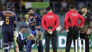 India's Ravindra Jadeja, third left, has a trainer tend to his leg during a break in batting against Australia during their T20 international cricket match at Manuka Oval, in Canberra.(AP) India's Ravindra Jadeja, third left, has a trainer tend to his leg during a break in batting against Australia during their T20 international cricket match at Manuka Oval, in Canberra.(AP)