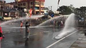 Police use tear gas shells and water cannon on BJP Yuva Morcha workers protesting against West Bengal govt at Tinbatti.(ANI) Police use tear gas shells and water cannon on BJP Yuva Morcha workers protesting against West Bengal govt at Tinbatti.(ANI)