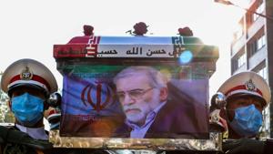Members of Iranian forces carry the coffin of Iranian nuclear scientist Mohsen Fakhrizadeh during a funeral ceremony in Tehran, Iran.(Reuters) Members of Iranian forces carry the coffin of Iranian nuclear scientist Mohsen Fakhrizadeh during a funeral ceremony in Tehran, Iran.(Reuters)