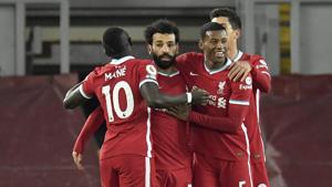 Liverpool's Mohamed Salah, 2nd left, celebrates after scoring the opening goal during the English Premier League soccer match between Liverpool and Wolverhampton Wanderers at Anfield Stadium.(AP) Liverpool's Mohamed Salah, 2nd left, celebrates after scoring the opening goal during the English Premier League soccer match between Liverpool and Wolverhampton Wanderers at Anfield Stadium.(AP)