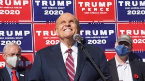 Rudy Giuliani speaks at a news conference in the parking lot of a landscaping company in Philadelphia in November.(AFP file) Rudy Giuliani speaks at a news conference in the parking lot of a landscaping company in Philadelphia in November.(AFP file)