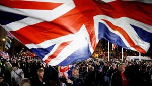 A man waves a British flag on Brexit day in London(REUTERS)