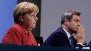 FILE PHOTO: German Chancellor Angela Merkel and Bavarian Federal State Premier Markus Soeder attend a news conference on the coronavirus disease (COVID-19) following video consultations with the premiers of Germany's 16 federal states, in Berlin, Germany, November 16, 2020. Odd Andersen/Pool via REUTERS/File Photo FILE PHOTO: German Chancellor Angela Merkel and Bavarian Federal State Premier Markus Soeder attend a news conference on the coronavirus disease (COVID-19) following video consultations with the premiers of Germany's 16 federal states, in Berlin, Germany, November 16, 2020. Odd Andersen/Pool via REUTERS/File Photo