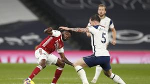 Soccer Football - Premier League - Tottenham Hotspur v Arsenal - Tottenham Hotspur Stadium, London, Britain - December 6, 2020 Arsenal's Thomas Partey in action with Tottenham Hotspur's Pierre-Emile Hojbjerg Pool via REUTERS/Paul Childs EDITORIAL USE ONLY. No use with unauthorized audio, video, data, fixture lists, club/league logos or 'live' services. Online in-match use limited to 75 images, no video emulation. No use in betting, games or single club /league/player publications. Please contact your account representative for further details.(Pool via REUTERS) Soccer Football - Premier League - Tottenham Hotspur v Arsenal - Tottenham Hotspur Stadium, London, Britain - December 6, 2020 Arsenal's Thomas Partey in action with Tottenham Hotspur's Pierre-Emile Hojbjerg Pool via REUTERS/Paul Childs EDITORIAL USE ONLY. No use with unauthorized audio, video, data, fixture lists, club/league logos or 'live' services. Online in-match use limited to 75 images, no video emulation. No use in betting, games or single club /league/player publications. Please contact your account representative for further details.(Pool via REUTERS)