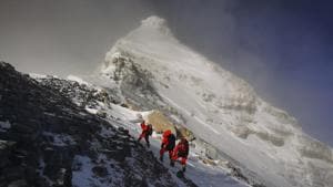In this May 27 photo, members of a Chinese surveying team head for the summit of Mount Everest, also known locally as Mt. Qomolangma.(AP file) In this May 27 photo, members of a Chinese surveying team head for the summit of Mount Everest, also known locally as Mt. Qomolangma.(AP file)