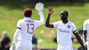 West Indies Kemar Roach, right, celebrates with Shamarh Brooks after taking the wicket of New Zealand's Henry Nicolls during play on day two of the first cricket test between the West Indies and New Zealand in Hamilton, New Zealand, Friday, Dec. 4, 2020.(AP) West Indies Kemar Roach, right, celebrates with Shamarh Brooks after taking the wicket of New Zealand's Henry Nicolls during play on day two of the first cricket test between the West Indies and New Zealand in Hamilton, New Zealand, Friday, Dec. 4, 2020.(AP)