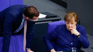 German Chancellor Angela Merkel and Health Minister Jens Spahn attend a session at the lower house of parliament Bundestag in Berlin, Germany. The political dispute over the broadcast fee has revived broader questions about how far Chancellor Angela Merkel’s center-right party will stand firm on refusing to cooperate with the far right.(Reuters) German Chancellor Angela Merkel and Health Minister Jens Spahn attend a session at the lower house of parliament Bundestag in Berlin, Germany. The political dispute over the broadcast fee has revived broader questions about how far Chancellor Angela Merkel’s center-right party will stand firm on refusing to cooperate with the far right.(Reuters)