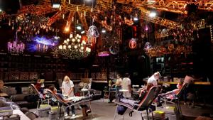 People give blood on the stage of the closed MAD (Moulin a Danse) night club during the outbreak of the coronavirus disease (COVID-19) in Lausanne, Switzerland.(REUTERS) People give blood on the stage of the closed MAD (Moulin a Danse) night club during the outbreak of the coronavirus disease (COVID-19) in Lausanne, Switzerland.(REUTERS)