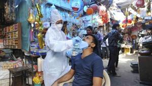 A health worker collects a sample for Covid-19 test, at a market in Mumbai.(File photo) A health worker collects a sample for Covid-19 test, at a market in Mumbai.(File photo)