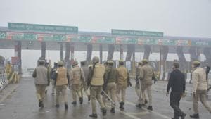 As agitating farmers have started capturing toll plazas, police deployed at Chhajarshi fee plaza in Uttar Pradesh. (Photo: Sakib Ali) As agitating farmers have started capturing toll plazas, police deployed at Chhajarshi fee plaza in Uttar Pradesh. (Photo: Sakib Ali)