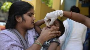 A health worker administers a deworming tablet to a boy during a door-to-door campaign in Hyderabad.(AFP/ File photo) A health worker administers a deworming tablet to a boy during a door-to-door campaign in Hyderabad.(AFP/ File photo)