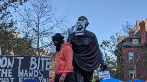 Posters and banners were seen pasted or propped up against the statue and a yellow flag was sighted draped over it.(Asian News International) Posters and banners were seen pasted or propped up against the statue and a yellow flag was sighted draped over it.(Asian News International)