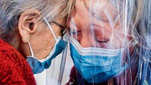 A resident (L) of the Domenico Sartor nursing home in Castelfranco Veneto, near Venice, hugs her visiting daughter through a plastic screen in a so-called “Hug Room” amid the new coronavirus pandemic.(AFP) A resident (L) of the Domenico Sartor nursing home in Castelfranco Veneto, near Venice, hugs her visiting daughter through a plastic screen in a so-called “Hug Room” amid the new coronavirus pandemic.(AFP)
