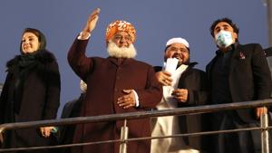 Maulana Fazal-ur-Rehman, center, Bilawal Bhutto Zardari, right, Maryam Nawaz Sharif, left, leaders of the Pakistan Democratic Movement, an alliance of opposition parties, attend an anti-government rally in Lahore, Pakistan, Sunday, Dec. 13, 2020. (AP Photo/K.M. Chaudary) Maulana Fazal-ur-Rehman, center, Bilawal Bhutto Zardari, right, Maryam Nawaz Sharif, left, leaders of the Pakistan Democratic Movement, an alliance of opposition parties, attend an anti-government rally in Lahore, Pakistan, Sunday, Dec. 13, 2020. (AP Photo/K.M. Chaudary)