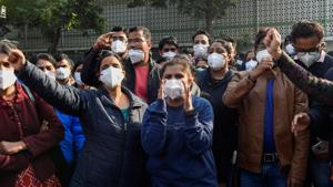 Members of AIIMS Nurses Union during their indefinite strike over their long-pending demands, including those concerning the Sixth Central Pay Commission and against contractual appointments, in New Delhi on Tuesday.(PTI Photo) Members of AIIMS Nurses Union during their indefinite strike over their long-pending demands, including those concerning the Sixth Central Pay Commission and against contractual appointments, in New Delhi on Tuesday.(PTI Photo)