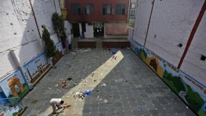 A man sweeping the floor at the premises of the damaged Rajdhani School after communal violence in north-east Delhi over the Citizenship Amendment Act (CAA), at Shiv Vihar, Karawal Nagar, in New Delhi on March 2, 2020.(Biplov Bhuyan/HT PHOTO) A man sweeping the floor at the premises of the damaged Rajdhani School after communal violence in north-east Delhi over the Citizenship Amendment Act (CAA), at Shiv Vihar, Karawal Nagar, in New Delhi on March 2, 2020.(Biplov Bhuyan/HT PHOTO)