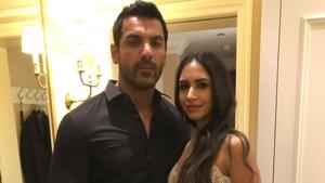 John Abraham and wife Priya Runchal pose together. John Abraham and wife Priya Runchal pose together.
