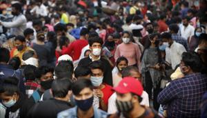 Indians wearing face masks as a precaution against the coronavirus shop at a market in New Delhi, India.(AP) Indians wearing face masks as a precaution against the coronavirus shop at a market in New Delhi, India.(AP)