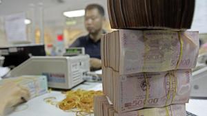 The Vietnamese dong traded at 23,127 per dollar, little changed from yesterday(AP) The Vietnamese dong traded at 23,127 per dollar, little changed from yesterday(AP)