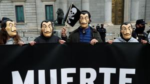People protest against a law to legalise euthanasia as Spanish Parliament prepares to vote on it.(REUTERS) People protest against a law to legalise euthanasia as Spanish Parliament prepares to vote on it.(REUTERS)