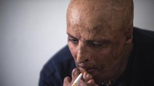 “I would never describe the act of self-immolation as an act of courage because even the bravest person in the world couldn’t do it,” Hosni Kalaia, 49, told the Associated Press in his family home(AP) “I would never describe the act of self-immolation as an act of courage because even the bravest person in the world couldn’t do it,” Hosni Kalaia, 49, told the Associated Press in his family home(AP)