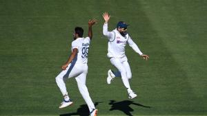 Indian captain Virat Kohli reacts with bowler Ravichandran Ashwin (L) on day 2 of the first test match between Australia and India at Adelaide Oval, Adelaide, Australia, December 18, 2020.(REUTERS) Indian captain Virat Kohli reacts with bowler Ravichandran Ashwin (L) on day 2 of the first test match between Australia and India at Adelaide Oval, Adelaide, Australia, December 18, 2020.(REUTERS)