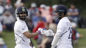India's Virat Kohli, left, and batting partner Cheteshwar Pujara(AP) India's Virat Kohli, left, and batting partner Cheteshwar Pujara(AP)