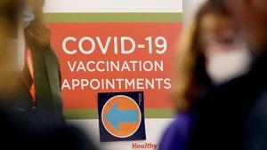 A Covid-19 vacation appointments sign points the way at Edward Hospital in Naperville, Ill., Thursday.(AP Photo) A Covid-19 vacation appointments sign points the way at Edward Hospital in Naperville, Ill., Thursday.(AP Photo)