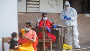 A health care worker prepares to screen people for Covid-19 infection at Govandi in Mumbai on December 17. India on December 18 became the second country in the world to see its total number of Covid-19 infections surpass 10 million, with the development coming at a time when rates of new infection appear to have fallen sharply over recent weeks. (Pratik Chorge / HT Photo) A health care worker prepares to screen people for Covid-19 infection at Govandi in Mumbai on December 17. India on December 18 became the second country in the world to see its total number of Covid-19 infections surpass 10 million, with the development coming at a time when rates of new infection appear to have fallen sharply over recent weeks. (Pratik Chorge / HT Photo)