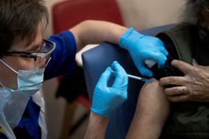 A man receives the first of two Pfizer/BioNTech COVID-19 vaccine jabs, at Guy's Hospital, at the start of the largest ever immunisation programme in the British history, in London, Britain.(REUTERS) A man receives the first of two Pfizer/BioNTech COVID-19 vaccine jabs, at Guy's Hospital, at the start of the largest ever immunisation programme in the British history, in London, Britain.(REUTERS)