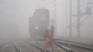 A woman crosses a railway track amid dense fog during a cold morning in Jalandhar on Friday.(PTI File Photo) A woman crosses a railway track amid dense fog during a cold morning in Jalandhar on Friday.(PTI File Photo)