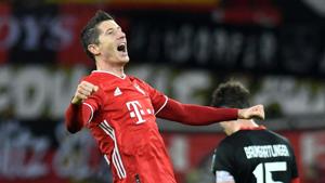 Soccer Football - Bundesliga - Bayer Leverkusen v Bayern Munich - BayArena, Leverkusen, Germany - December 19, 2020 Bayern Munich's Robert Lewandowski celebrates scoring their second goal Pool via REUTERS/Bernd Thissen DFL regulations prohibit any use of photographs as image sequences and/or quasi-video. TPX IMAGES OF THE DAY(Pool via REUTERS) Soccer Football - Bundesliga - Bayer Leverkusen v Bayern Munich - BayArena, Leverkusen, Germany - December 19, 2020 Bayern Munich's Robert Lewandowski celebrates scoring their second goal Pool via REUTERS/Bernd Thissen DFL regulations prohibit any use of photographs as image sequences and/or quasi-video. TPX IMAGES OF THE DAY(Pool via REUTERS)