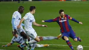 Barcelona:Barcelona's Lionel Messi, right, takes a shot at goal during the Spanish La Liga soccer match between Barcelona and Valencia at the Camp Nou stadium in Barcelona, Spain, Saturday, Dec. 19, 2020. AP/PTI Photo(AP20-12-2020_000008B)(AP) Barcelona:Barcelona's Lionel Messi, right, takes a shot at goal during the Spanish La Liga soccer match between Barcelona and Valencia at the Camp Nou stadium in Barcelona, Spain, Saturday, Dec. 19, 2020. AP/PTI Photo(AP20-12-2020_000008B)(AP)