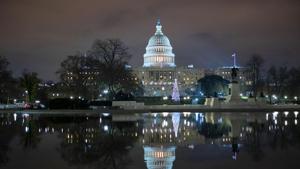 The US Capitol seen at night after negotiators sealed a deal for Covid relief on Sunday, finally delivering long-overdue help to businesses and individuals and providing money to deliver vaccines to a nation eager for them.(AP) The US Capitol seen at night after negotiators sealed a deal for Covid relief on Sunday, finally delivering long-overdue help to businesses and individuals and providing money to deliver vaccines to a nation eager for them.(AP)