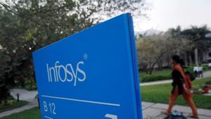 An employee walks past a signage board in the Infosys campus at the Electronics City IT district in Bangalore.(REUTERS) An employee walks past a signage board in the Infosys campus at the Electronics City IT district in Bangalore.(REUTERS)
