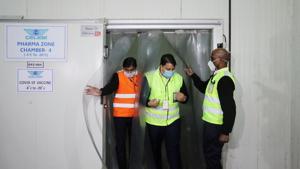 Ground staff exit a temperature-controlled storage room at a cargo terminal of the Indira Gandhi International Airport, which according to the officials will be used as a Covid-19 vaccine handling and distribution centre.(Reuters Photo) Ground staff exit a temperature-controlled storage room at a cargo terminal of the Indira Gandhi International Airport, which according to the officials will be used as a Covid-19 vaccine handling and distribution centre.(Reuters Photo)