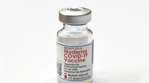 A vial of Moderna's COVID-19 vaccine is seen at Hartford Hospital, Monday, Dec. 21, 2020, in Hartford, Conn. Hartford HealthCare was the first in the state to administer the Moderna vaccine. (AP Photo/Jessica Hill)(AP) A vial of Moderna's COVID-19 vaccine is seen at Hartford Hospital, Monday, Dec. 21, 2020, in Hartford, Conn. Hartford HealthCare was the first in the state to administer the Moderna vaccine. (AP Photo/Jessica Hill)(AP)