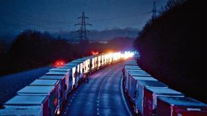 Lorries are seen parked on the M20 motorway, as EU countries impose a travel ban from the UK following the coronavirus disease (COVID-19) outbreak, near Ashford.(Reuters) Lorries are seen parked on the M20 motorway, as EU countries impose a travel ban from the UK following the coronavirus disease (COVID-19) outbreak, near Ashford.(Reuters)