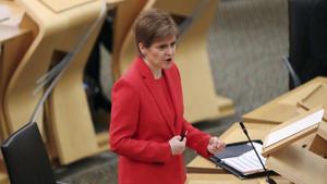Scotland's First Minister Nicola Sturgeon gives an update on COVID-19 restrictions, at the Scottish Parliament in Edinburgh, Scotland, Tuesday Dec. 22, 2020. Scotland has imposed some increased restrictions for the Christmas season. (Russell Cheyne/PA via AP) Scotland's First Minister Nicola Sturgeon gives an update on COVID-19 restrictions, at the Scottish Parliament in Edinburgh, Scotland, Tuesday Dec. 22, 2020. Scotland has imposed some increased restrictions for the Christmas season. (Russell Cheyne/PA via AP)
