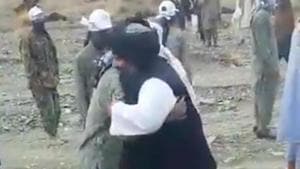 A video shows Mullah Fazal Akhund meeting masked men clad in fatigues at a Taliban training camp at an undisclosed location in Pakistan. The men can be seen embracing him and kissing his hand.(Sourced) A video shows Mullah Fazal Akhund meeting masked men clad in fatigues at a Taliban training camp at an undisclosed location in Pakistan. The men can be seen embracing him and kissing his hand.(Sourced)
