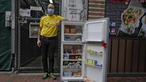 Ahmed Khan poses with a refrigerator at Woosung Street in Hong Kong's old-school neighborhood of Jordan.(AP) Ahmed Khan poses with a refrigerator at Woosung Street in Hong Kong's old-school neighborhood of Jordan.(AP)